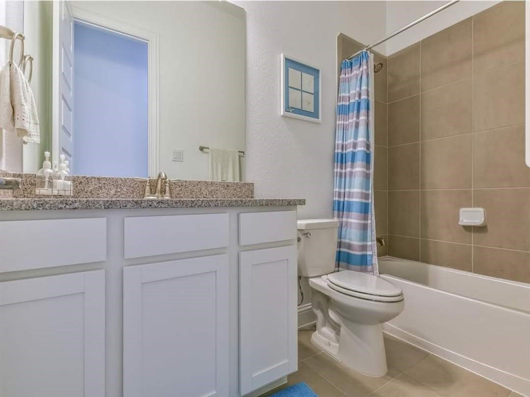 13326 Lake Chesdin Road Houston, TX 77044 - Photo 16 of 23 a bathroom with a granite countertop sink toilet and shower