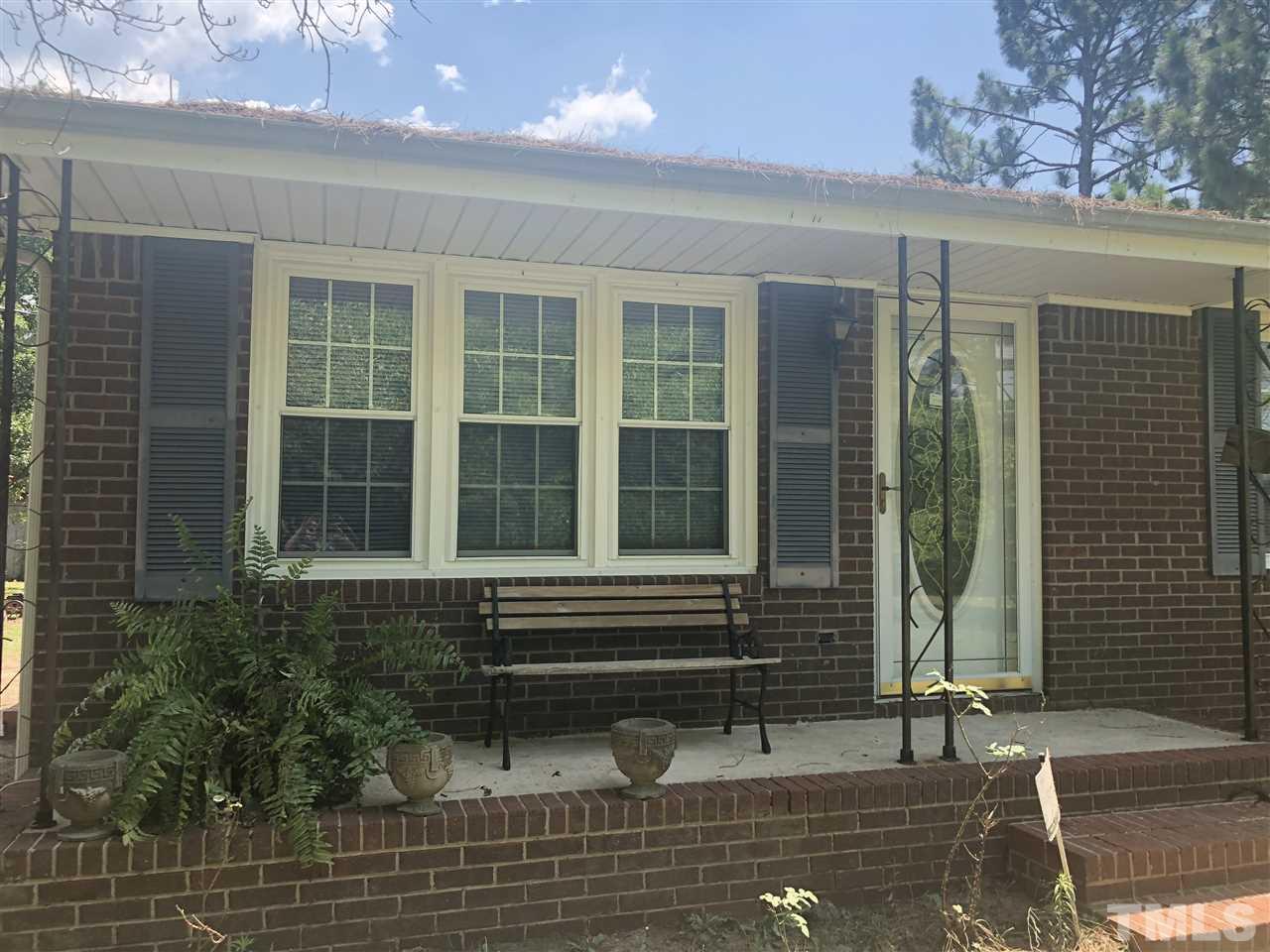 956 Fire Lane Road Bunnlevel, NC 28323 - Photo 1 of 16 a front view of a house with a yard
