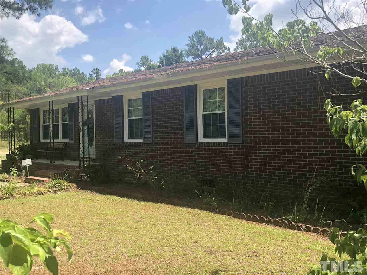 956 Fire Lane Road Bunnlevel, NC 28323 - Photo 2 of 16 a view of a house with a yard