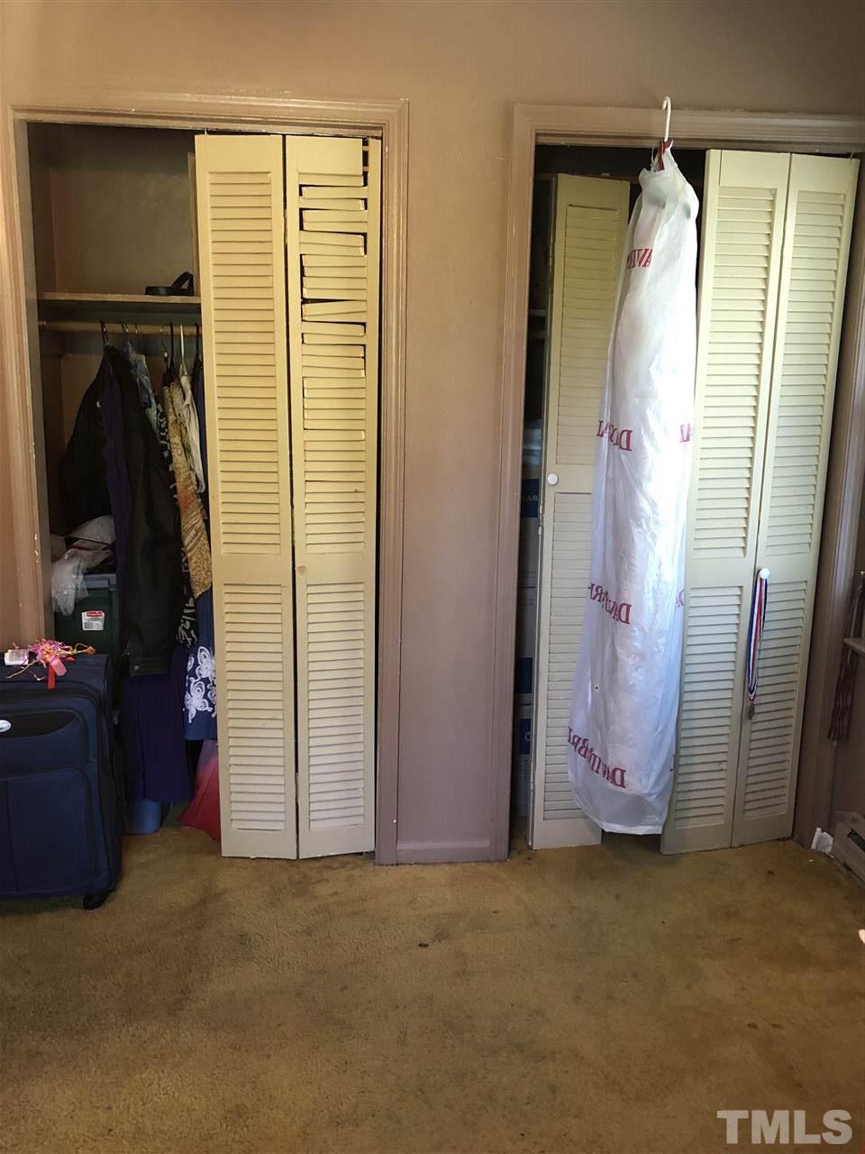 956 Fire Lane Road Bunnlevel, NC 28323 - Photo 13 of 16 a view of walk in closet with clothes