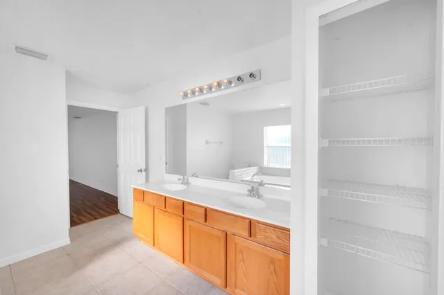 a bathroom with a sink a mirror and a bathtub