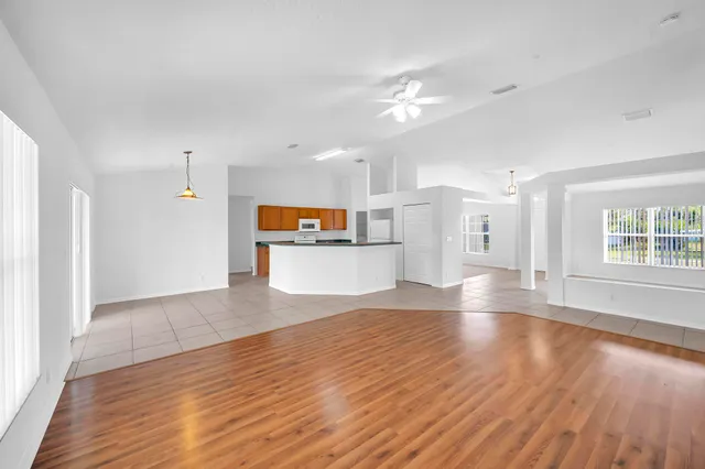 a view of kitchen with cabinets and wooden floor