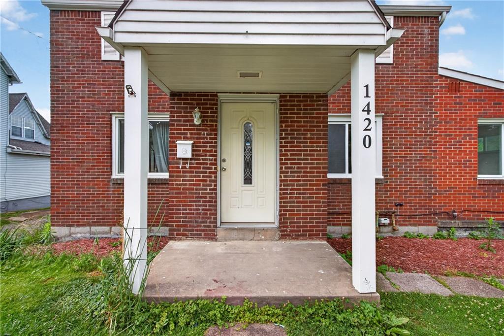 1420 Homestead Road Verona, PA 15147 - Photo 2 of 34 a front view of a house with garden