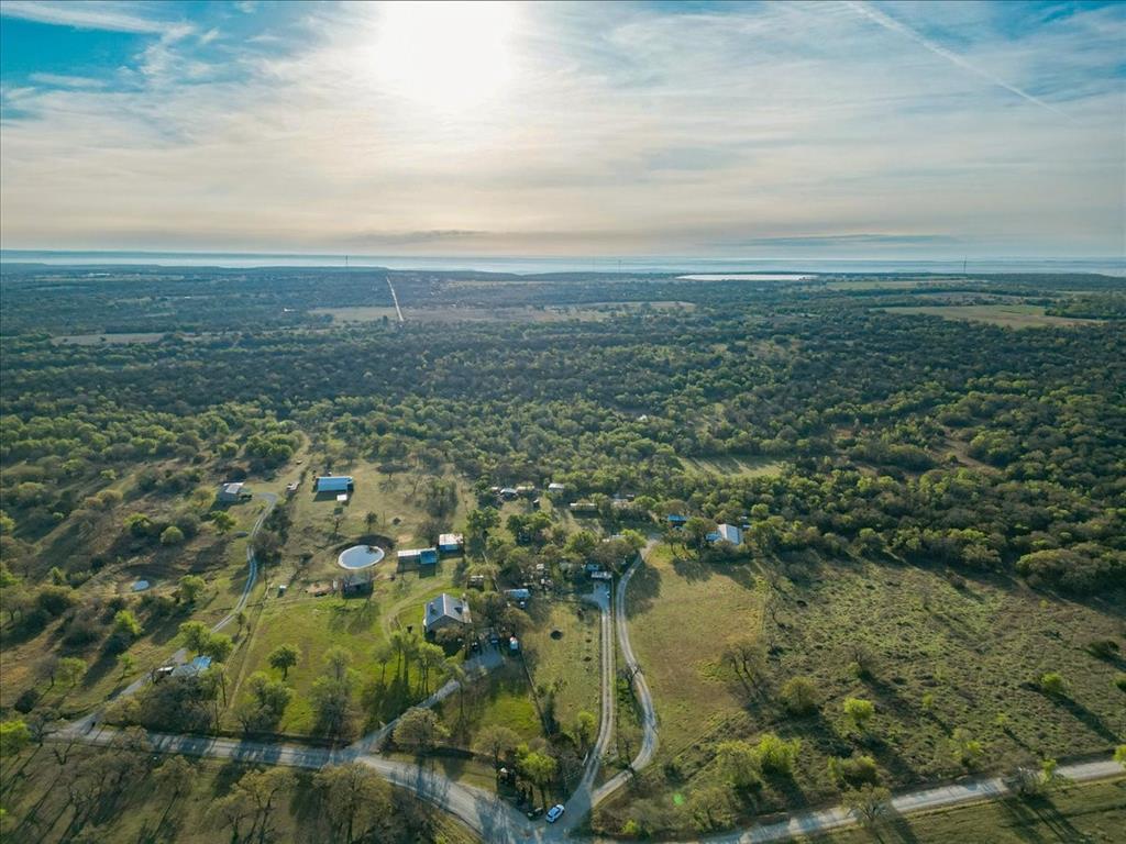 2991 Village Bend Road Mineral Wells, TX 76067 - Photo 15 of 23 an aerial view of residential houses with outdoor space and trees