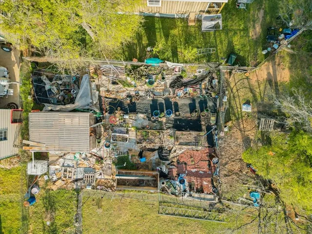 an aerial view of residential house with outdoor space