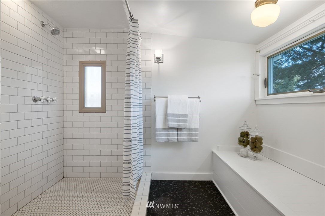 1614 Oakes Avenue Everett, WA 98201 - Photo 19 of 26 a bathroom with a bathtub and a shower