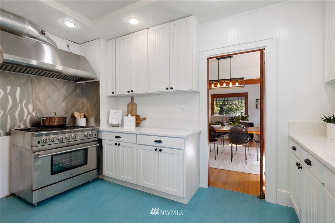 1614 Oakes Avenue Everett, WA 98201 - Photo 8 of 26 a kitchen with a stove and white cabinets