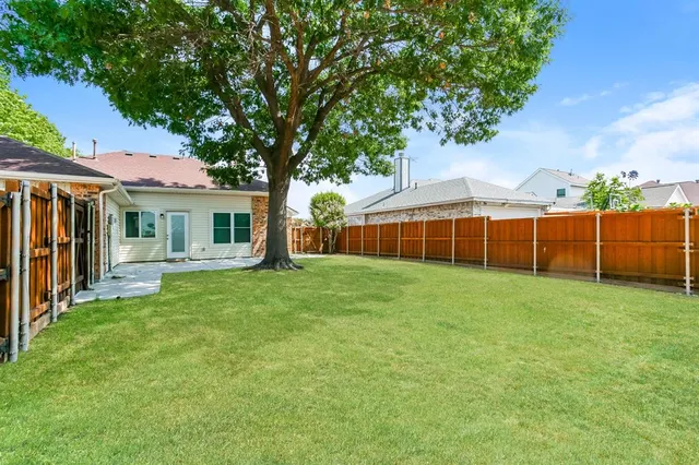 a view of a backyard of the house