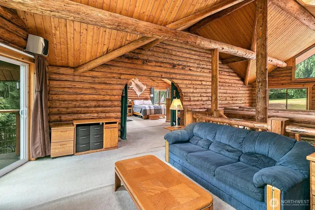 a view of patio with a couch and wooden fence