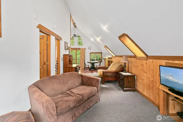 a bathroom with a toilet and a shower curtain