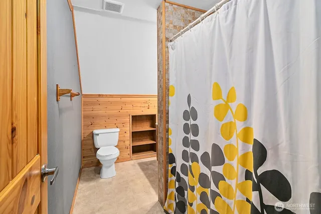 a bathroom with a sink toilet and tub
