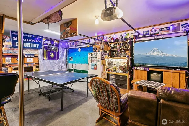 a room with fireplace furniture and a flat screen tv