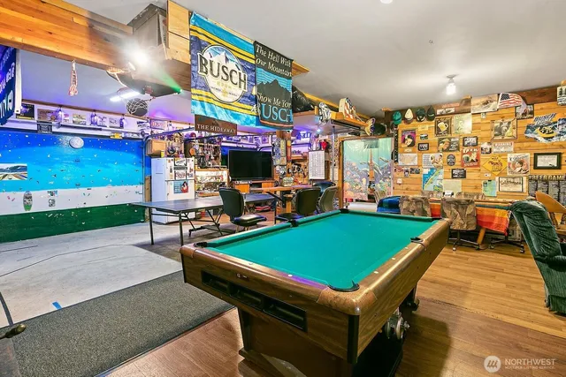 a kitchen with stainless steel appliances granite countertop a refrigerator and a stove