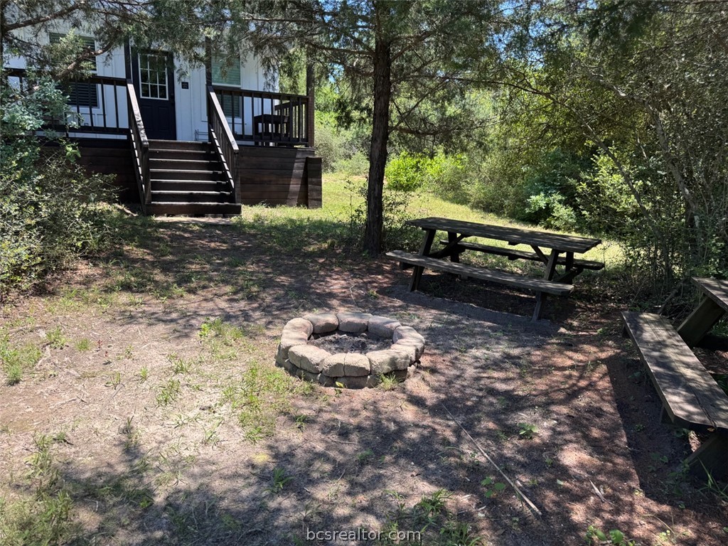 3454 Co Road Marquez, TX 77865 - Photo 17 of 35 a backyard of a house with barbeque oven table and chairs