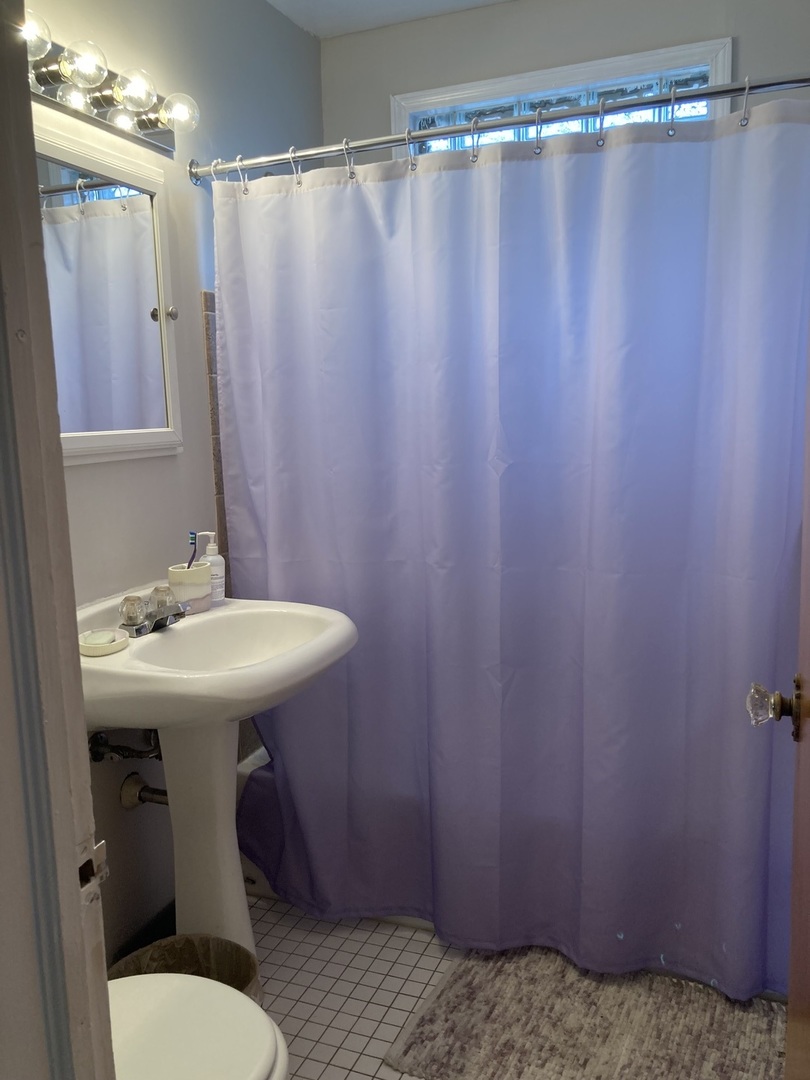 2140 Spruce Road Homewood, IL 60430 - Photo 9 of 14 a bathroom with a sink a toilet and shower