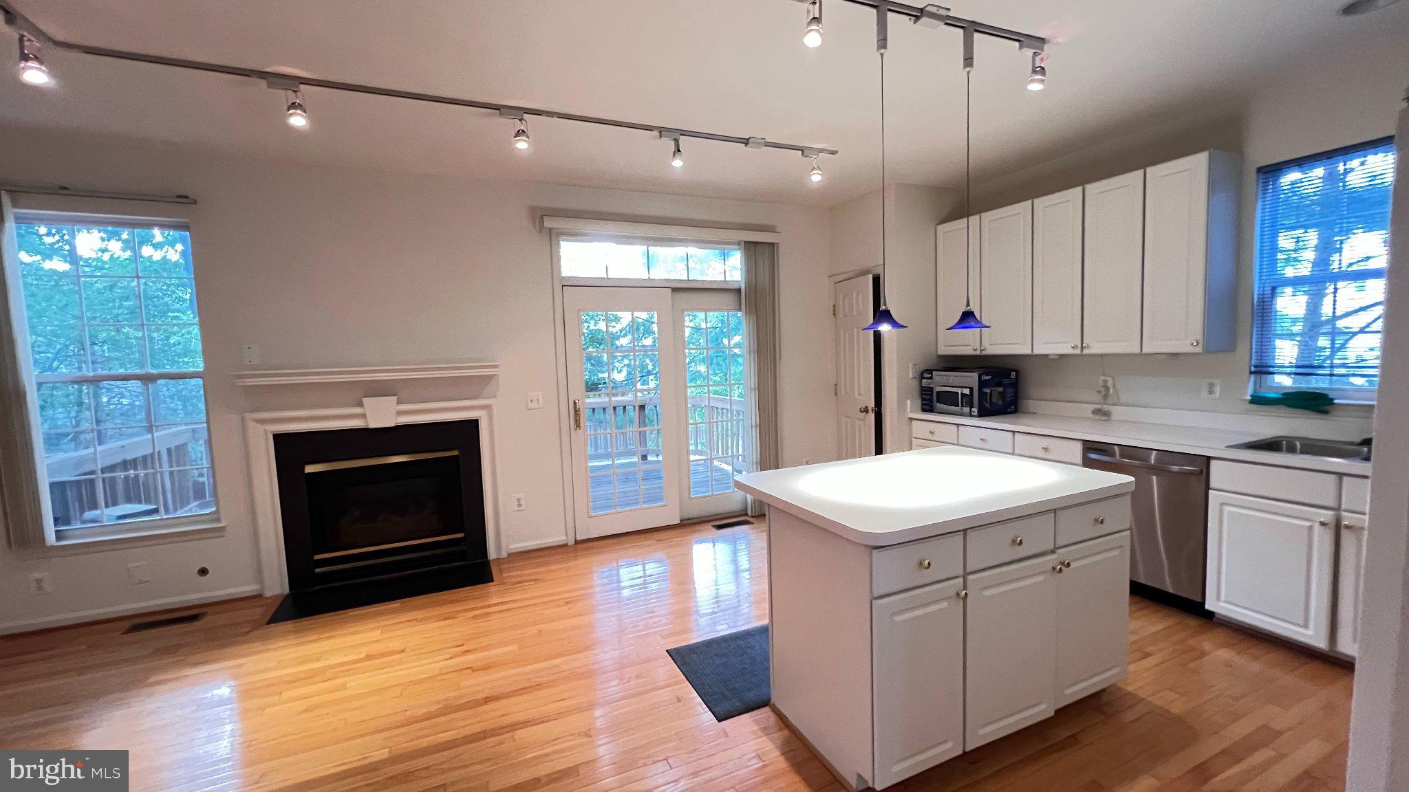 4100 Flower Fairfax, VA 22030 - Photo 10 of 47 a kitchen with a stove sink and a refrigerator