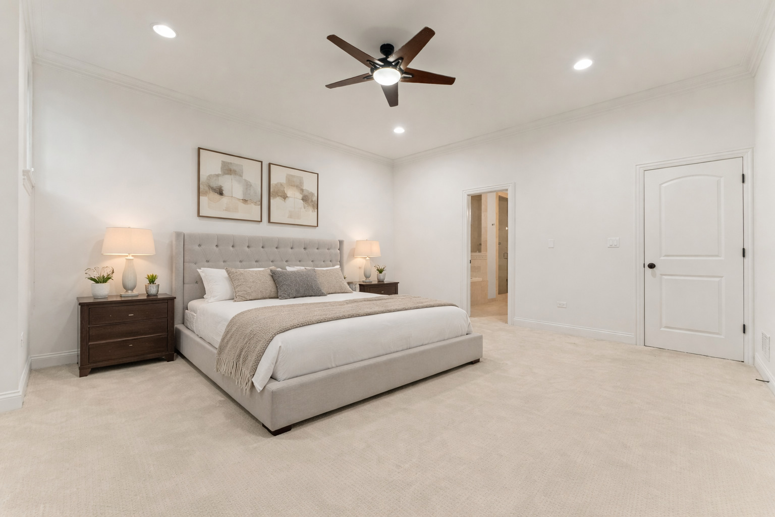 3716 North Kenmore Avenue, Unit 1 Chicago, IL 60613 - Photo 12 of 26 a spacious bedroom with a bed and a ceiling fan