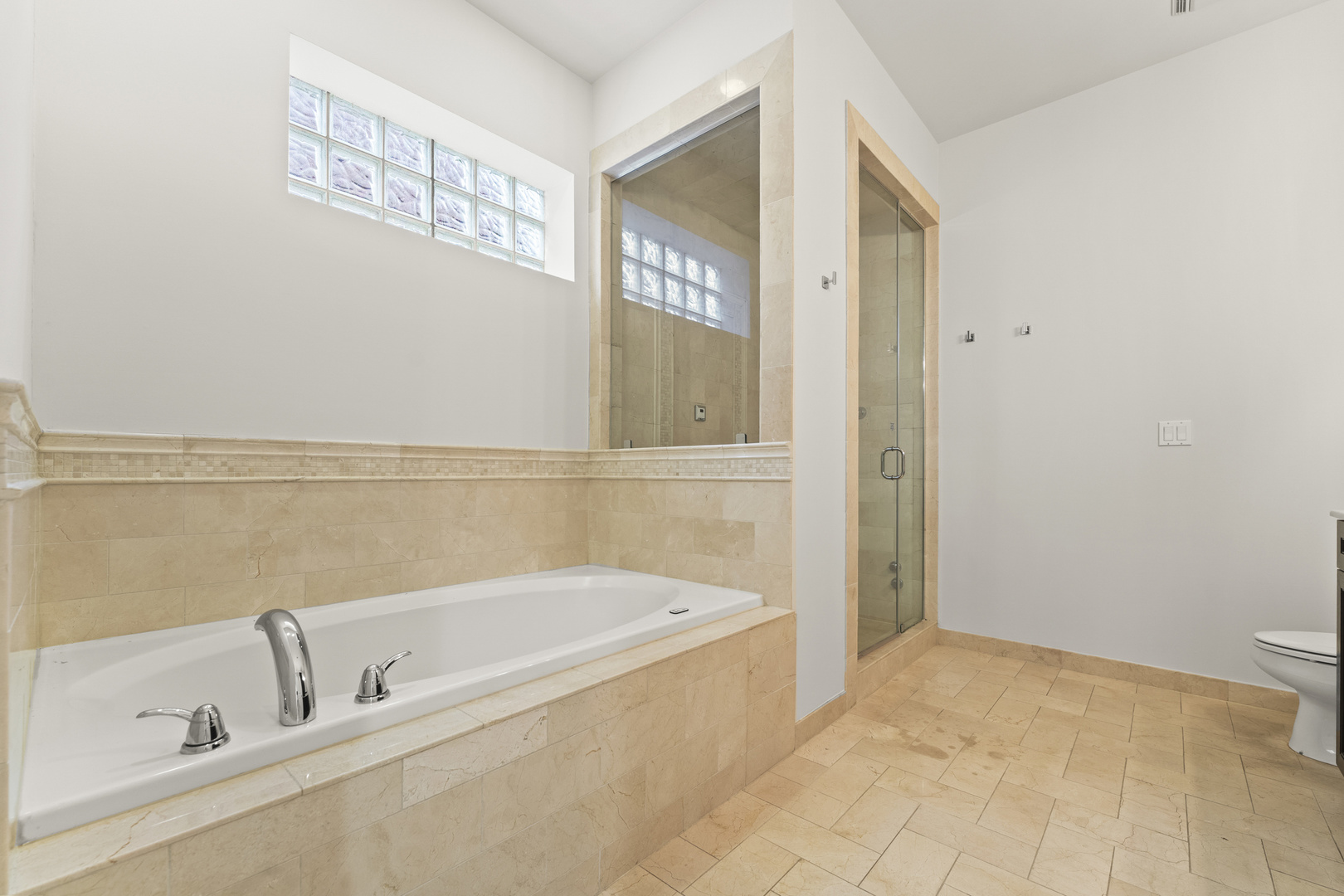3716 North Kenmore Avenue, Unit 1 Chicago, IL 60613 - Photo 19 of 33 a bathroom with a bathtub and a shower