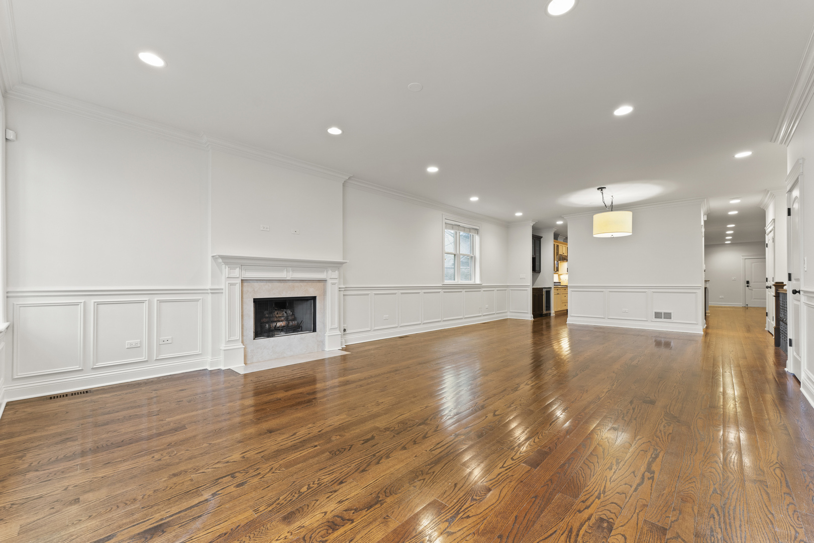 3716 North Kenmore Avenue, Unit 1 Chicago, IL 60613 - Photo 2 of 33 a view of a kitchen with a sink and a fireplace
