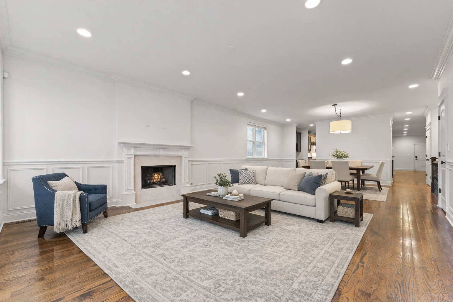 3716 North Kenmore Avenue, Unit 1 Chicago, IL 60613 - Photo 2 of 26 a living room with furniture and a fireplace