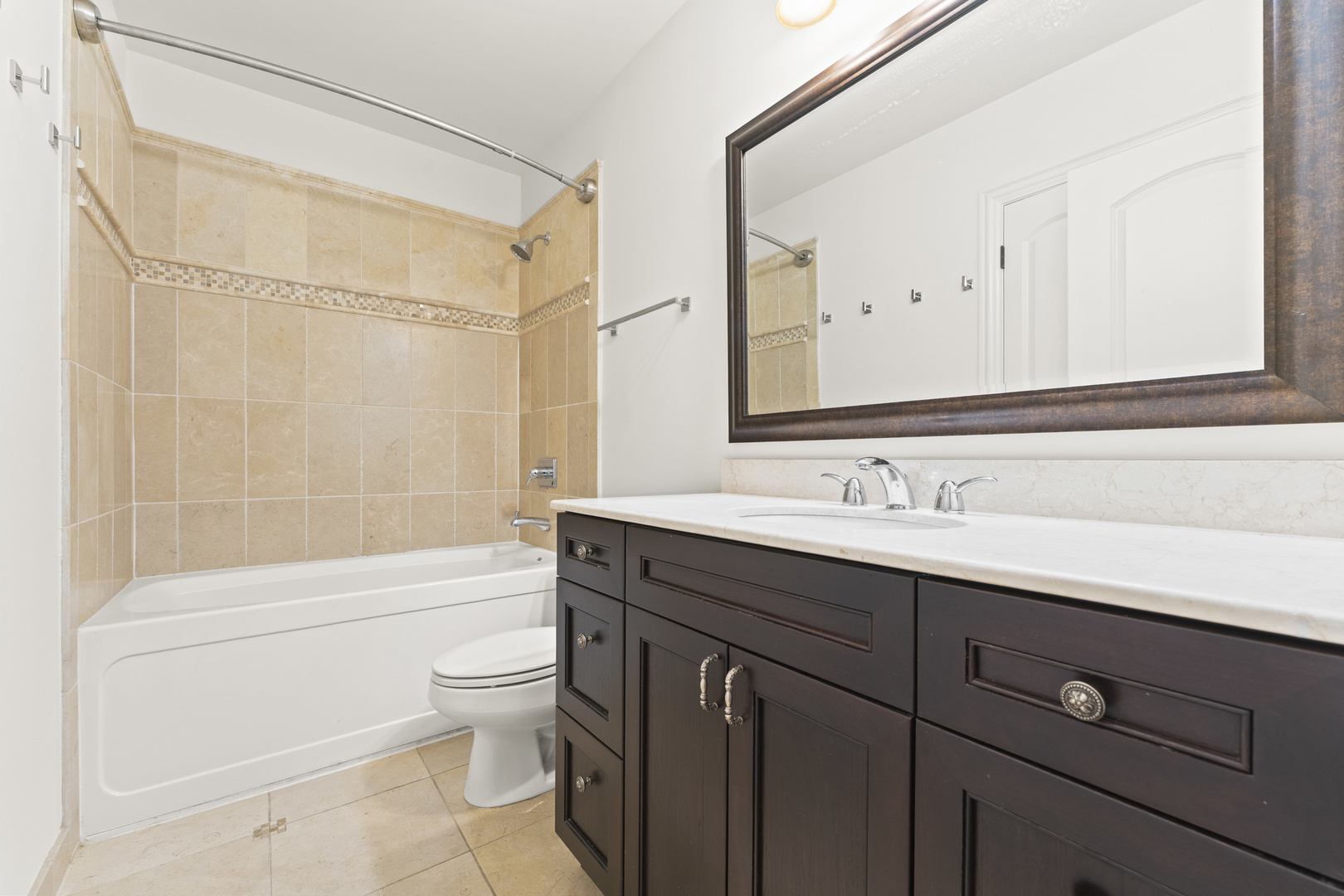 3716 North Kenmore Avenue, Unit 1 Chicago, IL 60613 - Photo 23 of 33 a bathroom with a sink a toilet and a bathtub