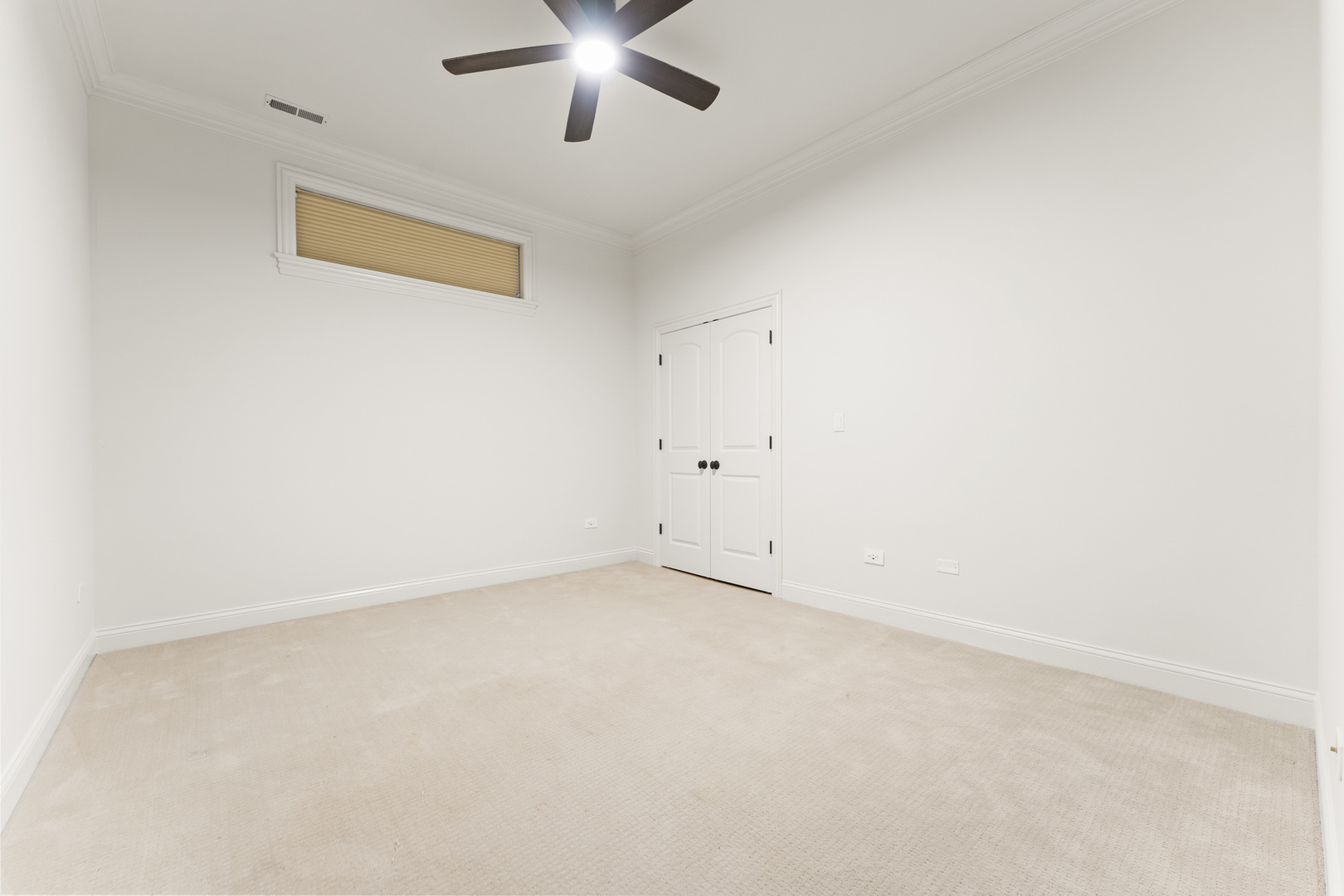 3716 North Kenmore Avenue, Unit 1 Chicago, IL 60613 - Photo 24 of 33 an empty room with a chandelier fan