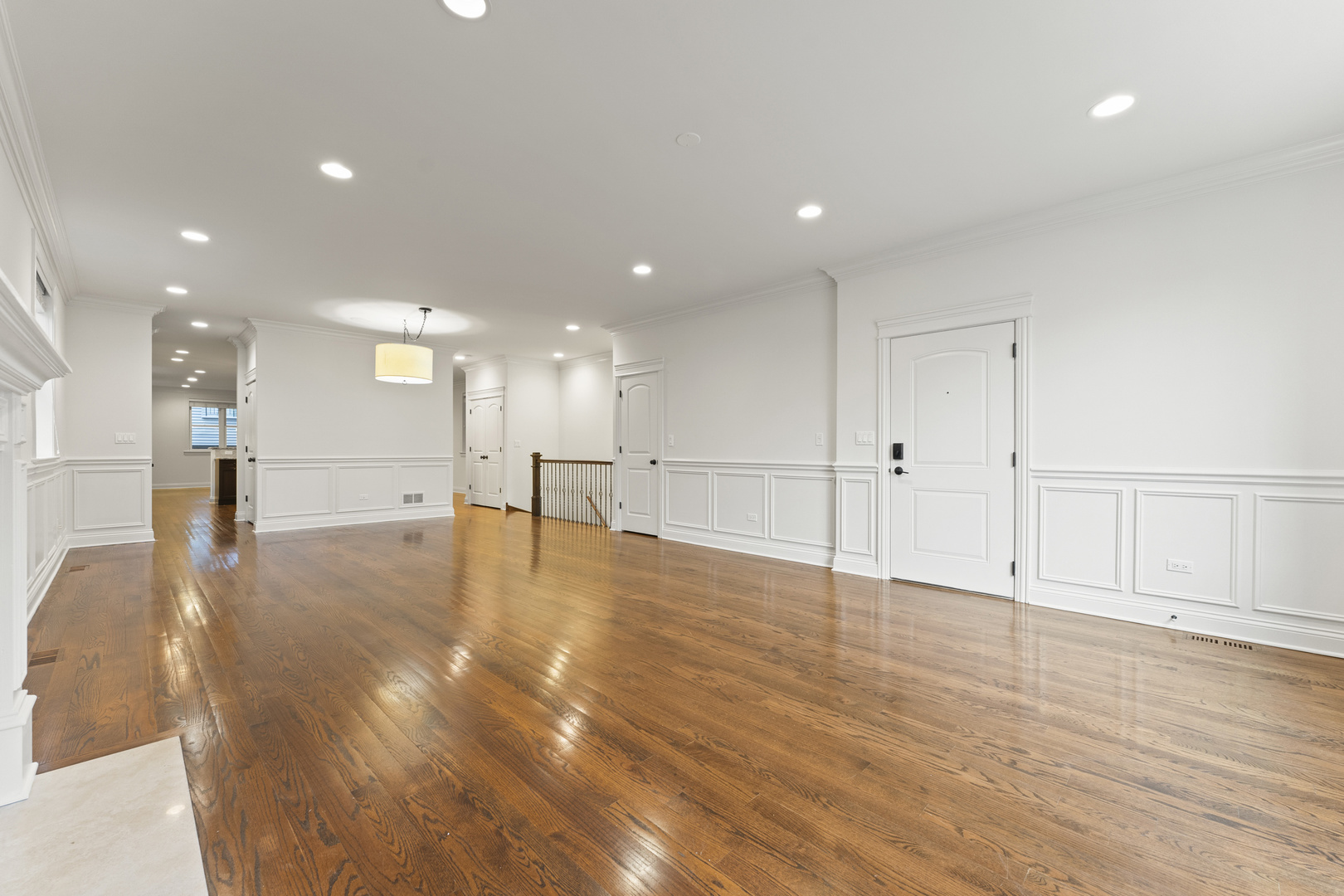 3716 North Kenmore Avenue, Unit 1 Chicago, IL 60613 - Photo 4 of 33 a view of an empty room with wooden floor