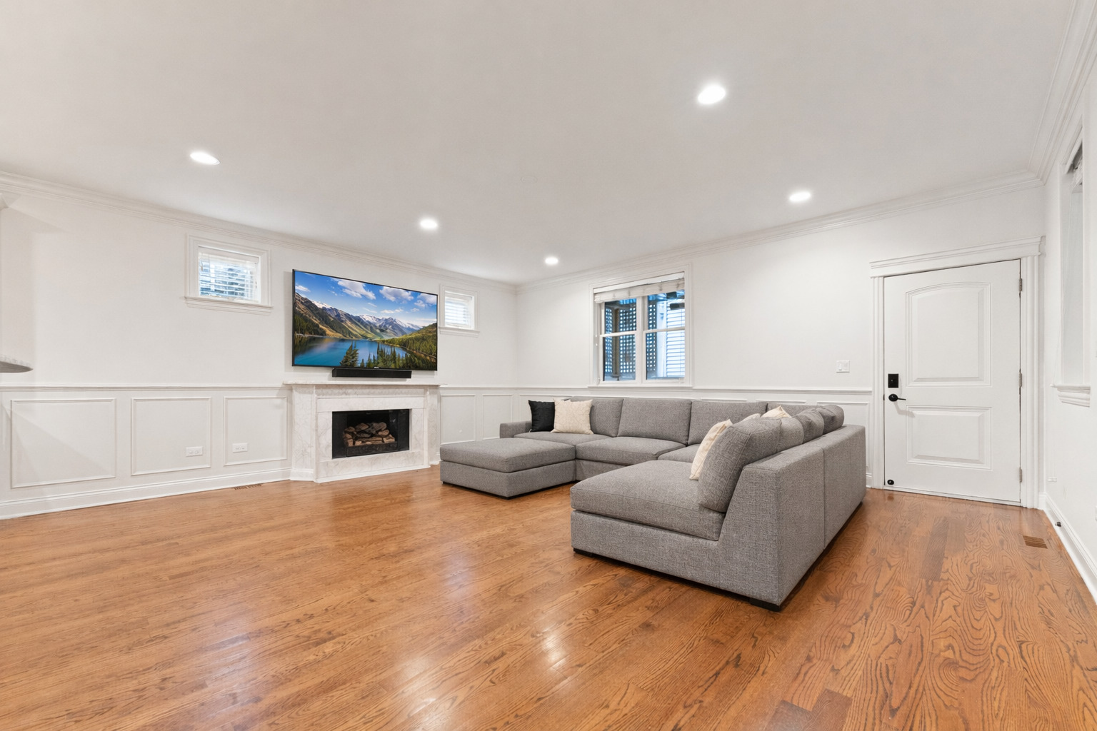 3716 North Kenmore Avenue, Unit 1 Chicago, IL 60613 - Photo 9 of 26 a living room with furniture and a fireplace