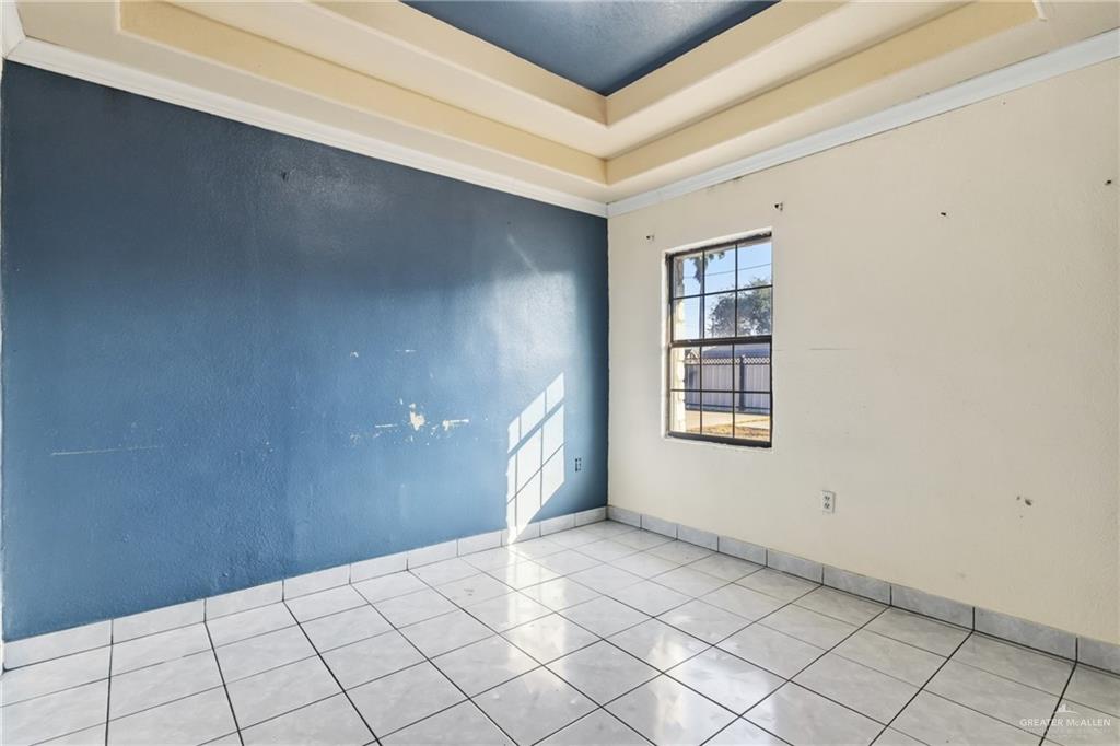 335 Watts Avenue Weslaco, TX 78596 - Photo 11 of 15 a view of an empty room and window
