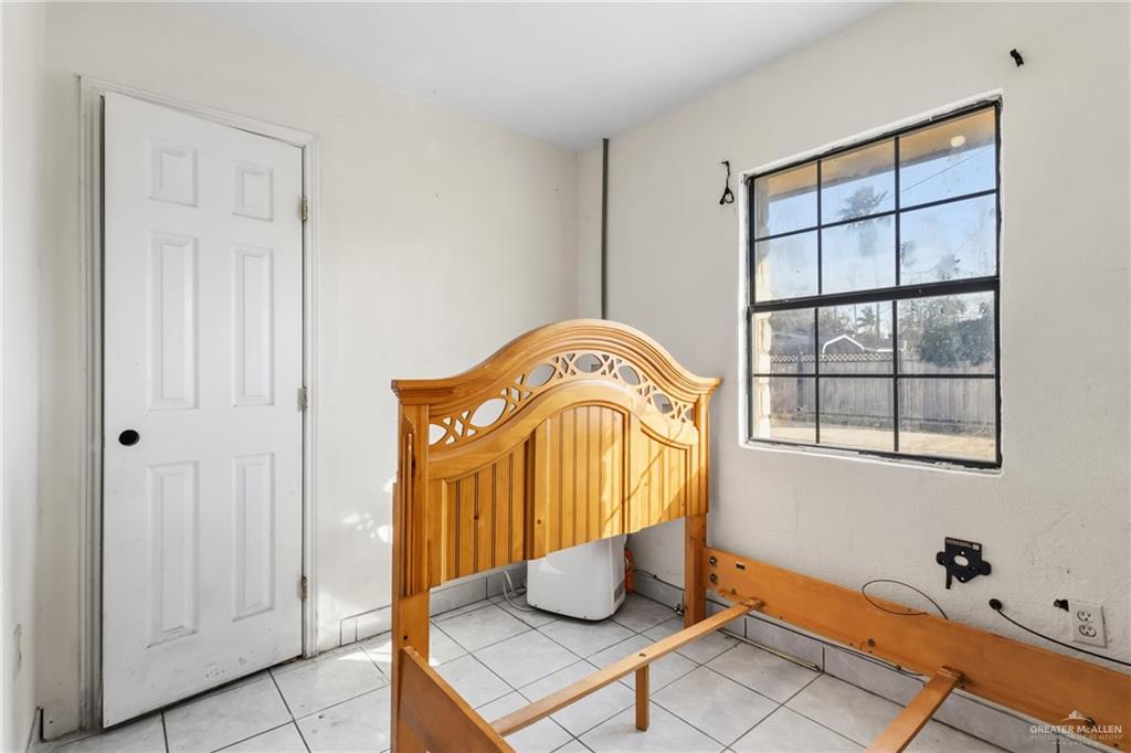 335 Watts Avenue Weslaco, TX 78596 - Photo 12 of 15 a room with window and potted plant