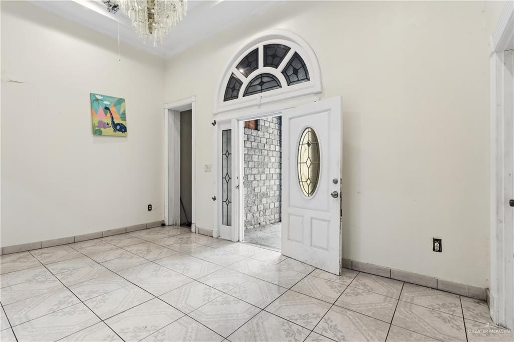 335 Watts Avenue Weslaco, TX 78596 - Photo 4 of 15 a view of a hallway with windows