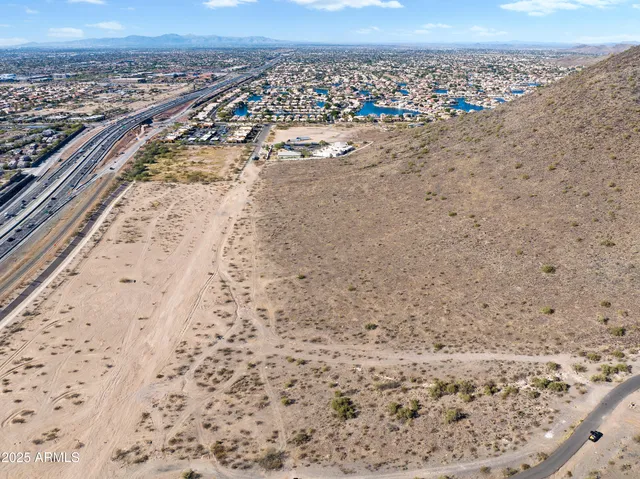 a view of a dry yard with a mountain