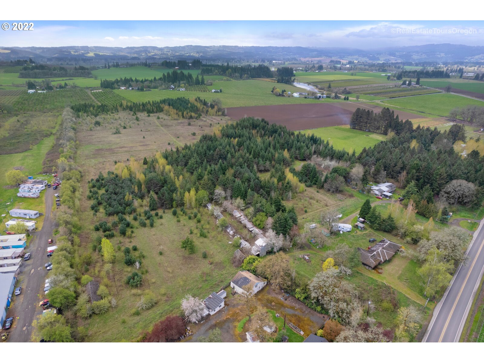 23940 Southwest Farmington Road Hillsboro, OR 97123 - Photo 4 of 13 a view of a lake with a house