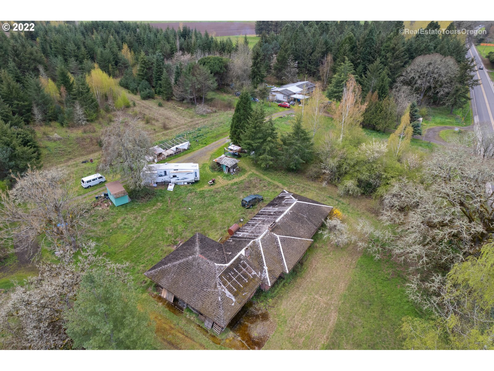 23940 Southwest Farmington Road Hillsboro, OR 97123 - Photo 10 of 13 a view of a house with a yard