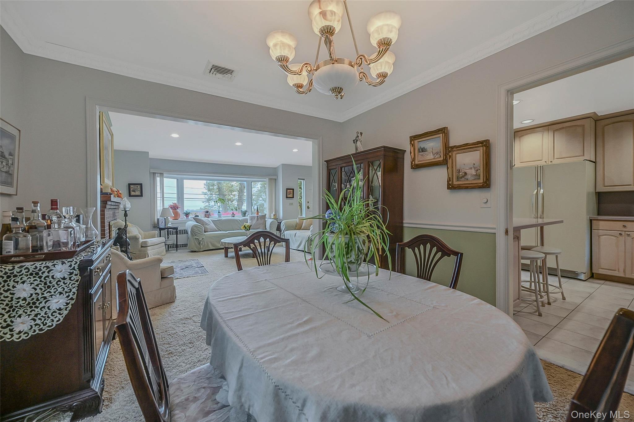 746 Sound View Road Mill Neck, NY 11765 - Photo 11 of 37 a view of a dining room with furniture