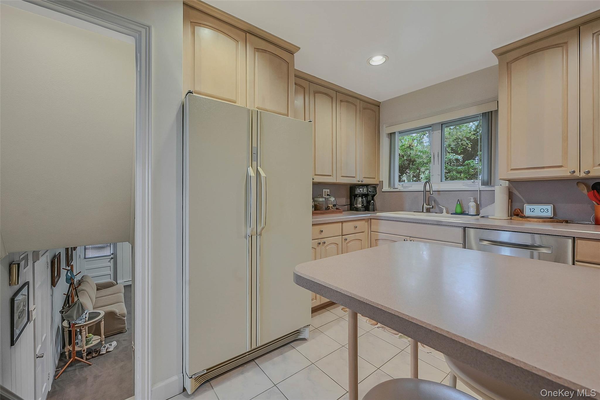 746 Sound View Road Mill Neck, NY 11765 - Photo 15 of 37 a kitchen with stainless steel appliances a refrigerator a sink a stove and cabinets