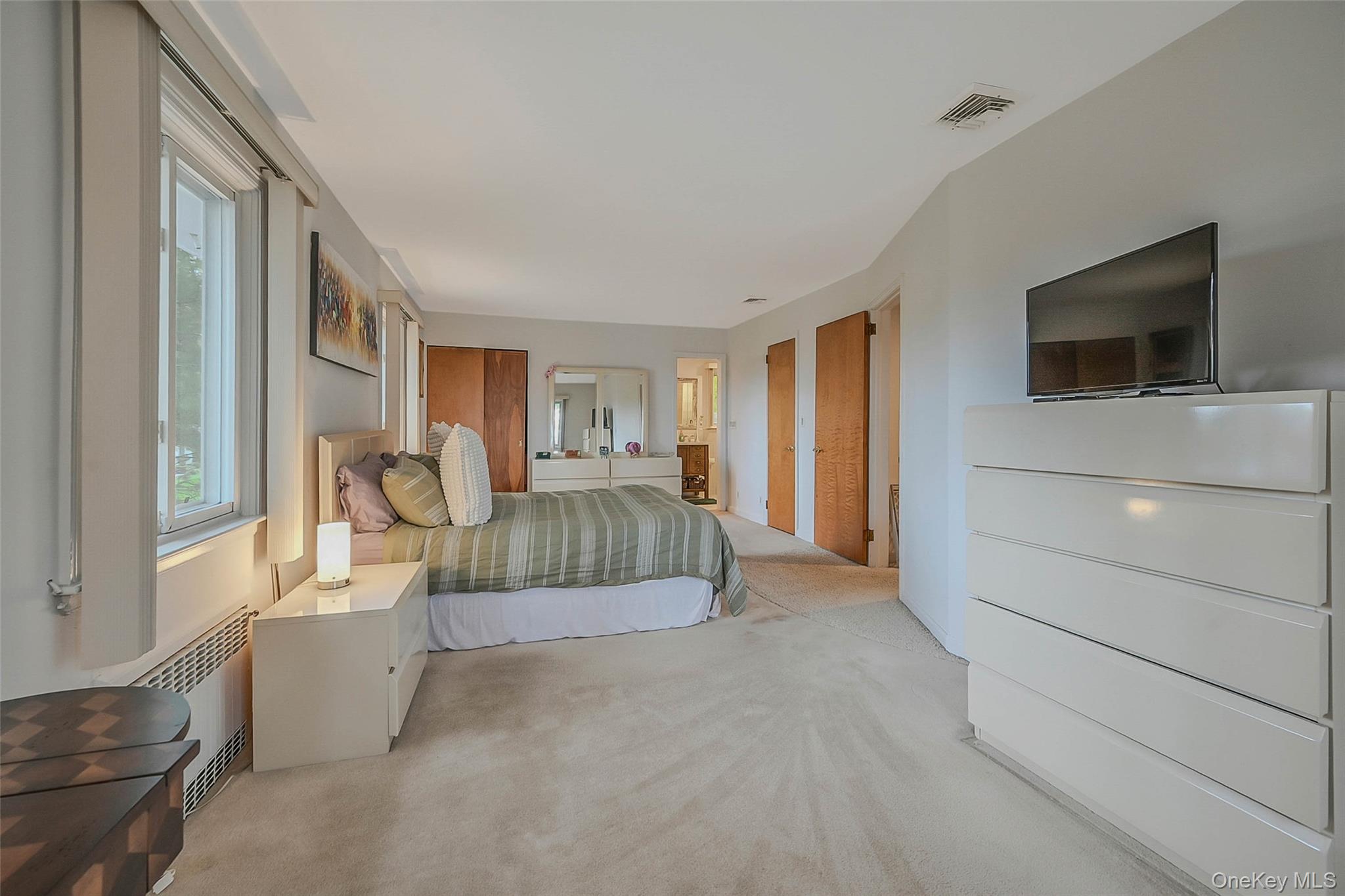 746 Sound View Road Mill Neck, NY 11765 - Photo 19 of 37 a living room with a couch and a flat screen tv