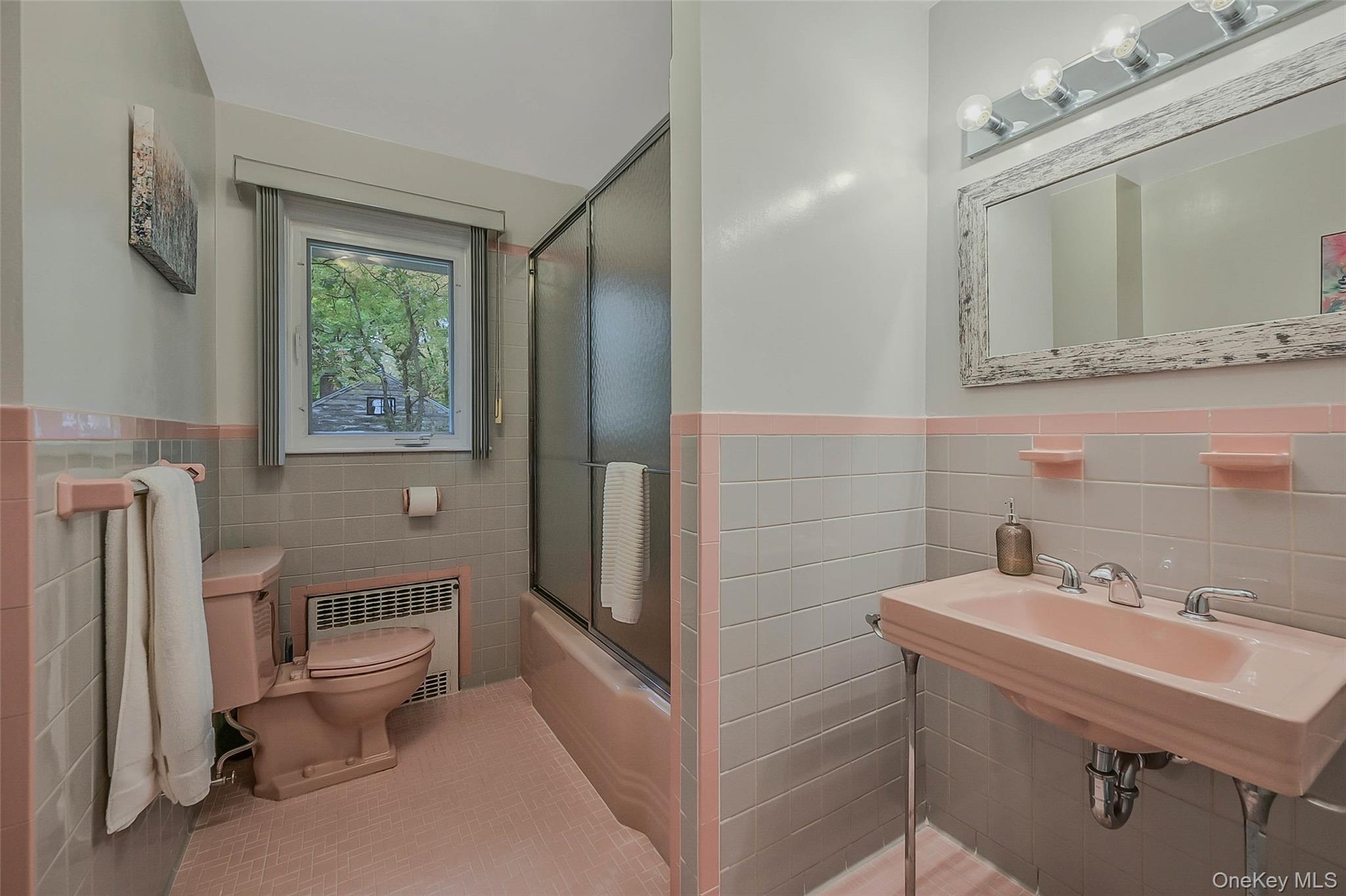 746 Sound View Road Mill Neck, NY 11765 - Photo 23 of 37 a bathroom with a sink toilet and mirror