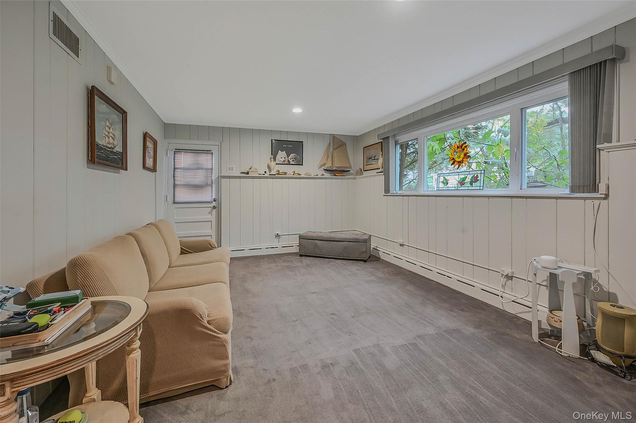 746 Sound View Road Mill Neck, NY 11765 - Photo 24 of 37 a living room with furniture and a window