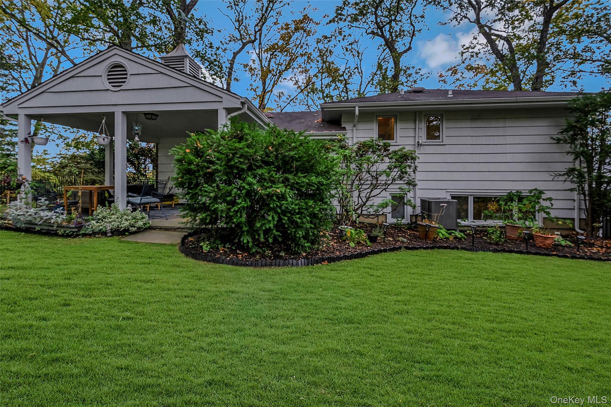 746 Sound View Road Mill Neck, NY 11765 - Photo 29 of 37 a view of a house with a garden