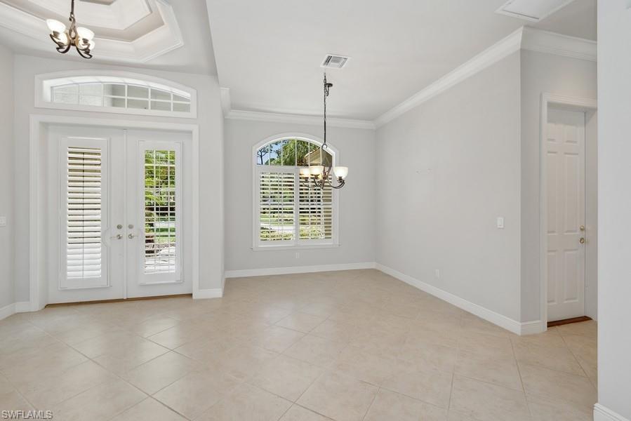 502 Cormorant Cove Naples, FL 34113 - Photo 12 of 25 a view of an empty room with a window