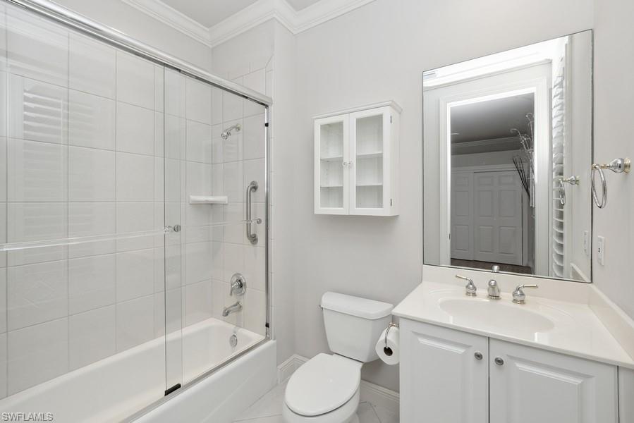502 Cormorant Cove Naples, FL 34113 - Photo 20 of 25 a bathroom with a sink toilet and shower