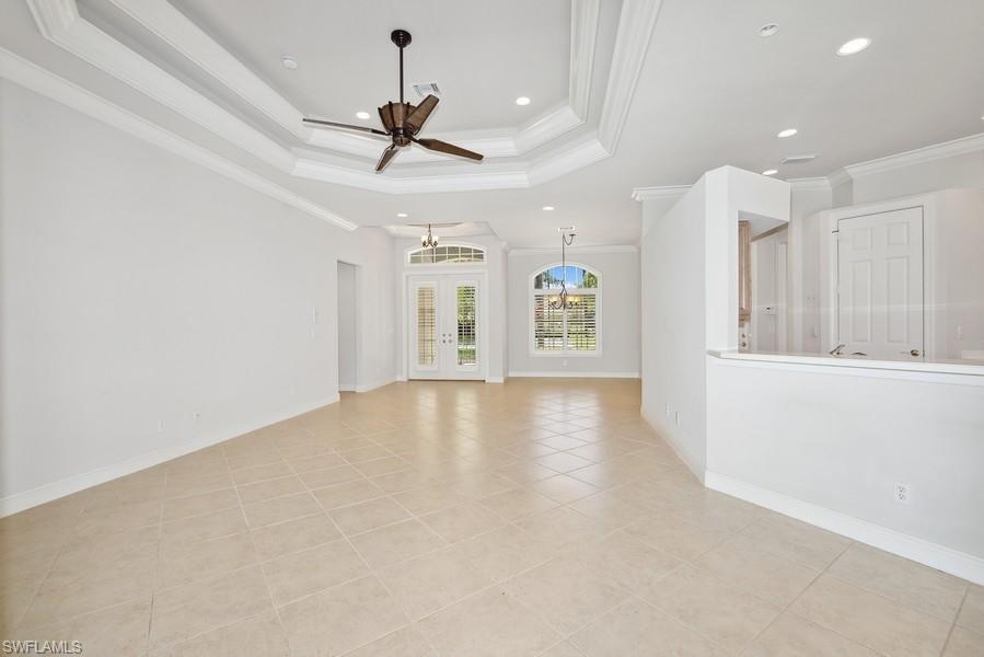 502 Cormorant Cove Naples, FL 34113 - Photo 6 of 25 a view of an empty room with window and cabinet