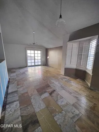 a view of empty room with windows