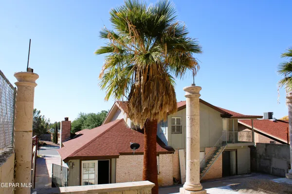 a view of a backyard of a house