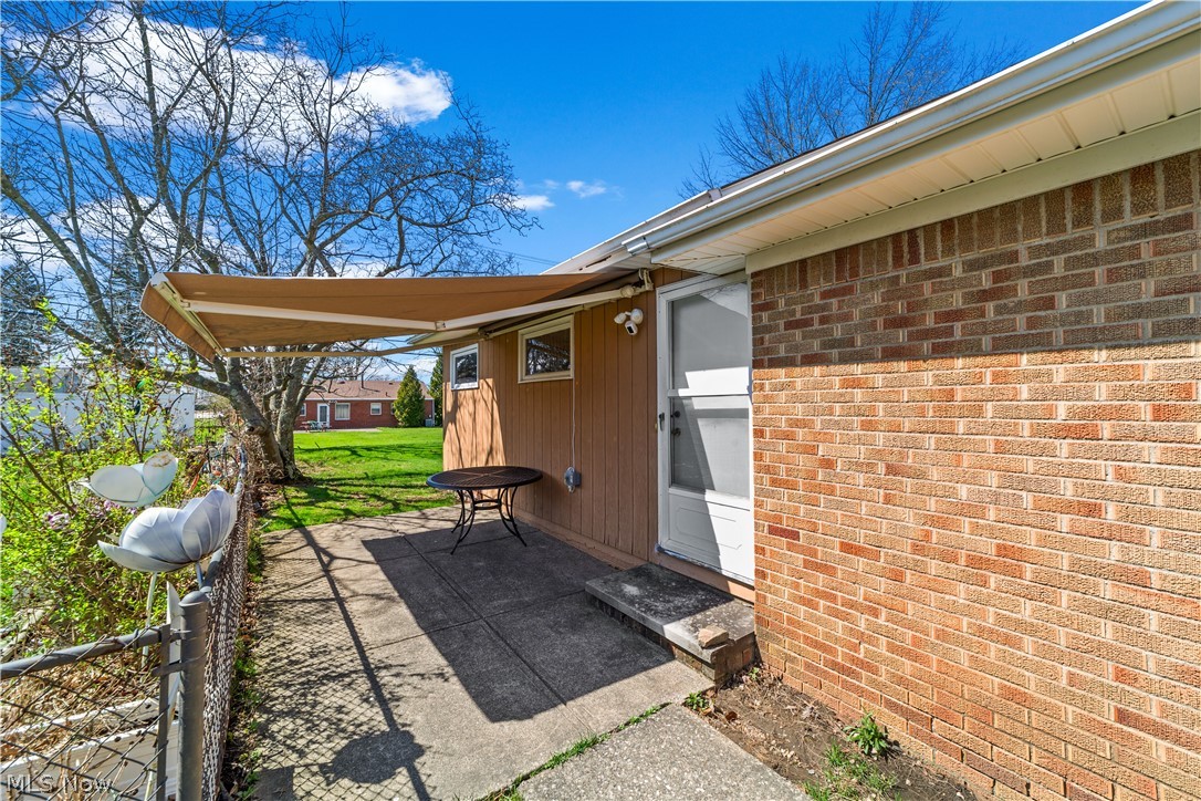 1730 Alcester Road Mayfield Heights, OH 44124 - Photo 27 of 39 Side patio featuring a high end retractable awning