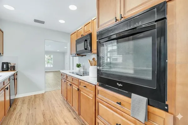 a kitchen with stainless steel appliances a refrigerator and a stove