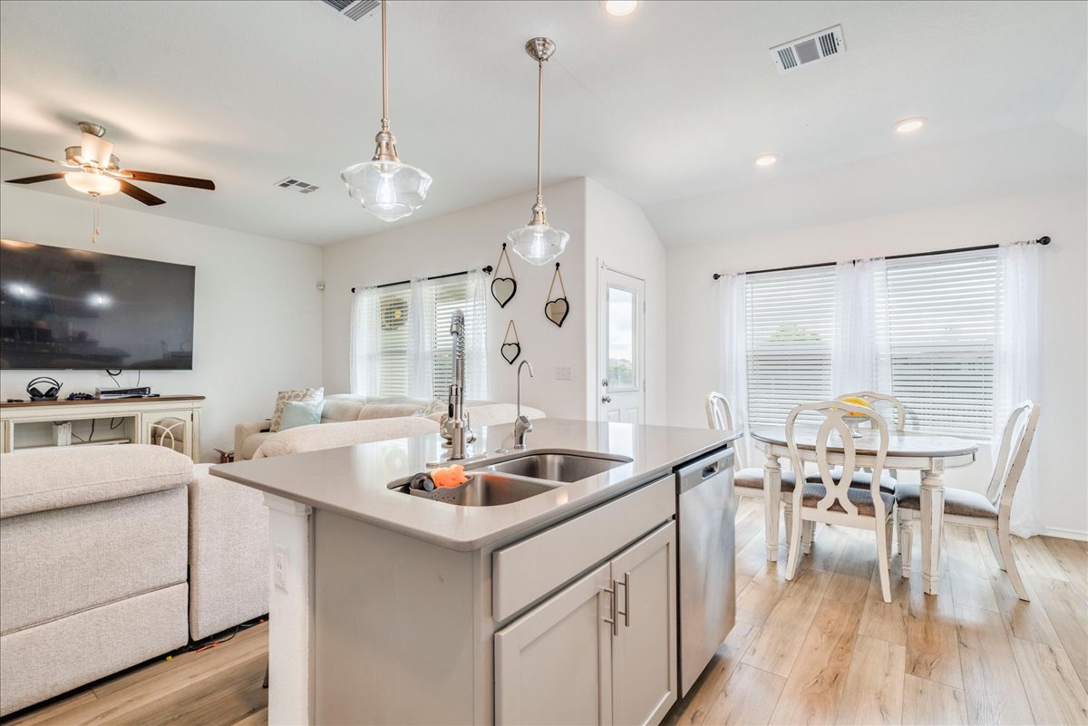 389 Salt Springs Road Kyle, TX 78640 - Photo 30 of 30 An open concept floorplan seamlessly connects the kitchen and dining areas.