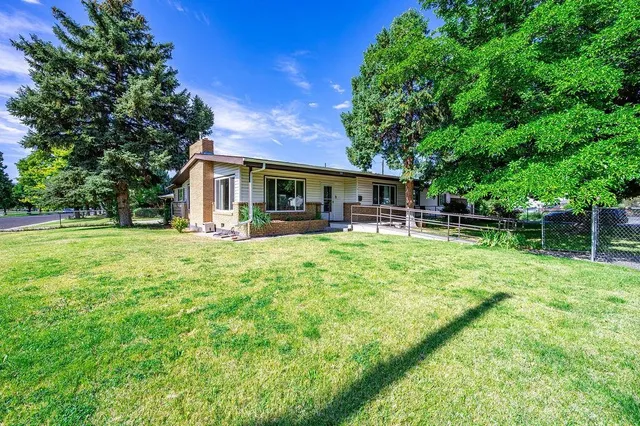 a front view of house with yard and seating area