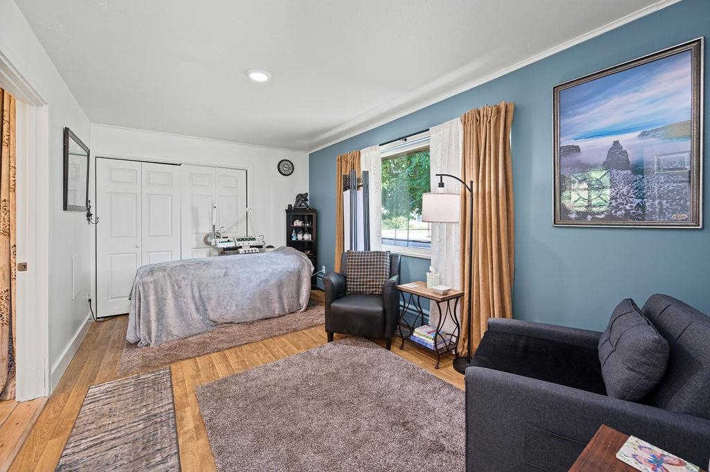 181 Elm Avenue Grand Junction, CO 81501 - Photo 11 of 25 a bedroom with furniture and a large window